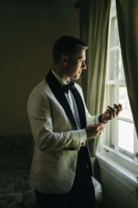 groom at Riegel Hall window